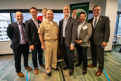 (Left to right: Eric Yates, Johannes Schonberg, Denise Ryser, Capt. Jon Moretty, Congressman Rick Larsen, Dave Nierescher, Justin Dunnicliff, Deloit Wolfe)